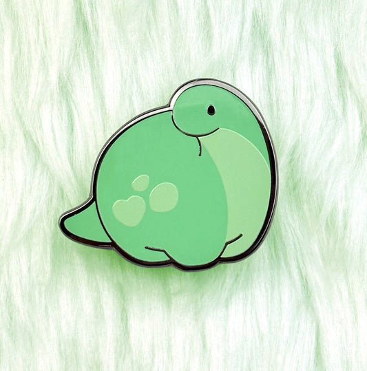 cute dinosaur enamel pin of a green diplodocus called pistachio