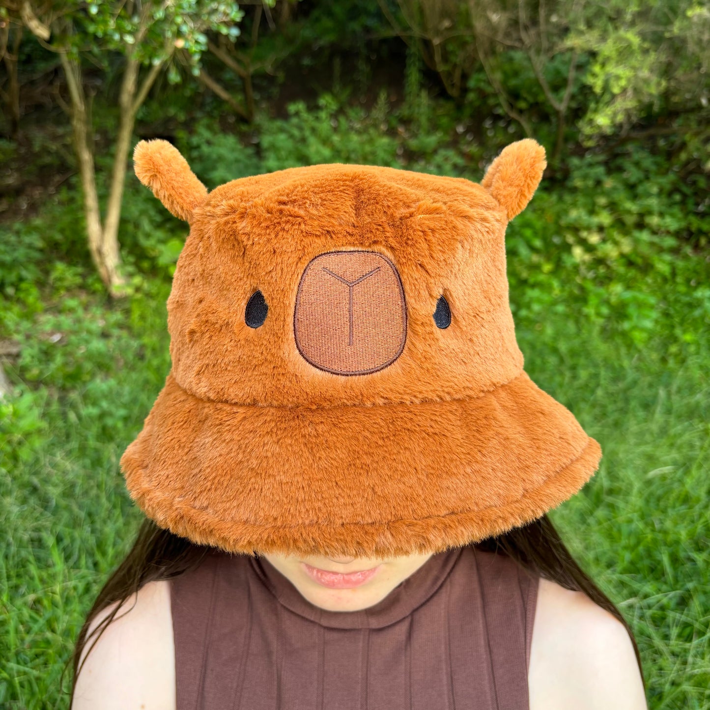 Brown Fluffy Bucket Hat with cute capybara face.